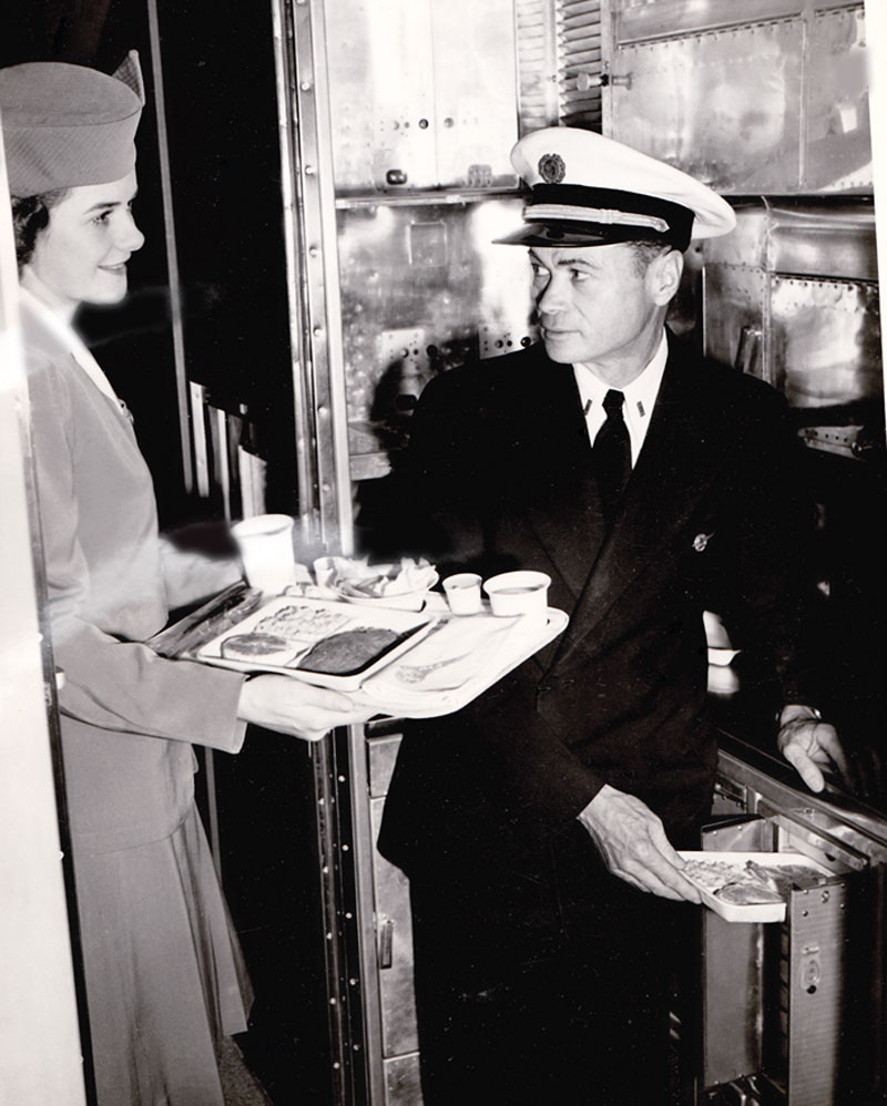 Pan Am Stewardess Alice Lemieux in Galley with Purser Raymond Tunstall on board June 1947 Round The World Constellation Flight