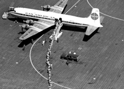 Aerial photo of American troops boarding Pan Am flight, Saigon