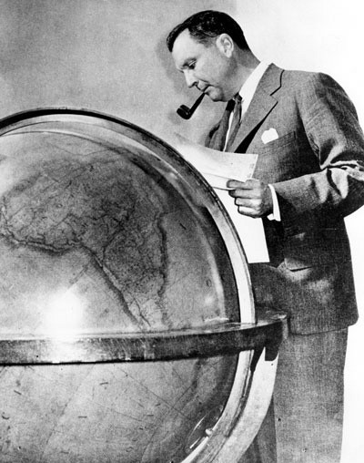 Iconic Image of Juan Trippe studying his globe, now on display at Smithsonian Institution